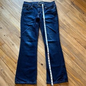 Levi’s 9 524 bootcut dark wash jeans. Very small stain on left knee see photos